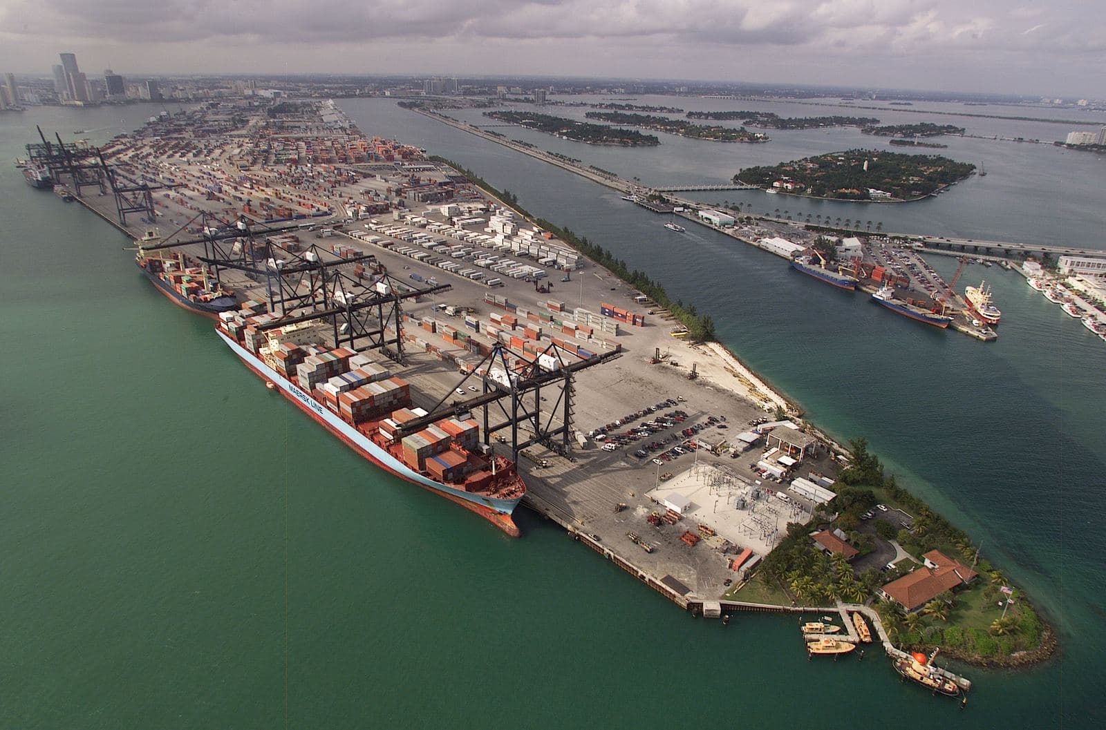 Aerial view of the Port of Miami container terminal, with a Maersk container ship under gantry cranes